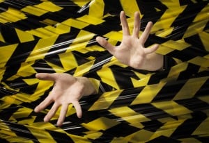 hands-tangled-in-tape