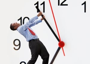 man-yanking-clock-hand-back