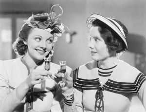 two-women-holding-drinks-smiling
