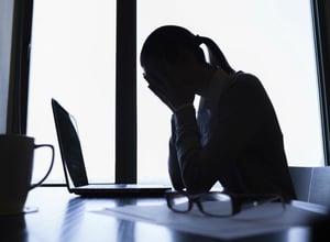 woman feeling disappointed despair at computer