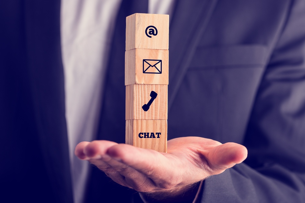 man holds call email chat heirarchy of communication