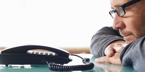 man waiting for phone to ring